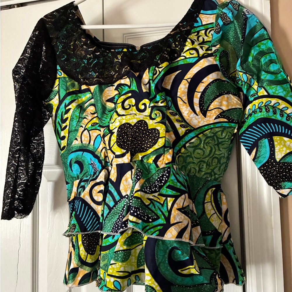 African silk woman top featuring green, blue, and black patterned ruffle medium